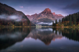 Switzerland, Glarus, mountain lake in the fog in the morning Switzerland, Glarus, mountain lake in the fog in the morning